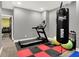 Bright exercise room featuring a treadmill, Everlast punching bag, and rubberized flooring at 4931 Kerrington Blvd, Bargersville, IN 46106