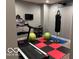 Home gym with a treadmill, free weights, and exercise balls, offering a convenient workout space at 4931 Kerrington Blvd, Bargersville, IN 46106