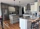Modern kitchen features stainless steel appliances, granite countertops, and a central island with seating at 4931 Kerrington Blvd, Bargersville, IN 46106