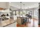Open concept kitchen features granite counters, stainless appliances and an eat in dining nook at 4931 Kerrington Blvd, Bargersville, IN 46106