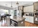 Kitchen with stainless appliances, granite counters, seating at the island, and an eat in dining area at 4931 Kerrington Blvd, Bargersville, IN 46106