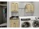 Laundry room with cabinets, sink, and newer model washer and dryer at 4931 Kerrington Blvd, Bargersville, IN 46106