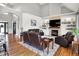 Open-concept living room featuring vaulted ceilings, a fireplace, and comfortable leather seating at 4931 Kerrington Blvd, Bargersville, IN 46106