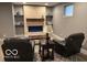 Cozy living area with a modern fireplace, comfortable seating, and stylish decor, ideal for relaxation at 4931 Kerrington Blvd, Bargersville, IN 46106