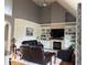 This living room boasts a fireplace, built-in shelves, and hardwood floors for a cozy space at 4931 Kerrington Blvd, Bargersville, IN 46106