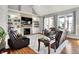Comfortable living room with a cozy fireplace, built-in bookshelves, and lots of natural light at 4931 Kerrington Blvd, Bargersville, IN 46106