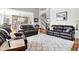 Spacious living room featuring a white rug, fireplace, recessed lighting, and hardwood floors at 4931 Kerrington Blvd, Bargersville, IN 46106