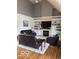 Cozy living room boasts a fireplace, built-in shelves, and hardwood floors, perfect for relaxation at 4931 Kerrington Blvd, Bargersville, IN 46106