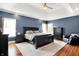 Main bedroom with trey ceiling, large windows, and hardwood floors at 4931 Kerrington Blvd, Bargersville, IN 46106