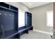 Mudroom features custom built-in cubbies with hooks and bench seating with a window for natural light at 4931 Kerrington Blvd, Bargersville, IN 46106
