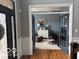 Home office features french doors, a desk, and natural light, creating an ideal workspace at 4931 Kerrington Blvd, Bargersville, IN 46106