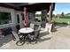 Inviting outdoor patio with stone fireplace, dining table, seating and built-in grill perfect for entertaining at 4931 Kerrington Blvd, Bargersville, IN 46106