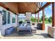 Covered patio featuring an outdoor fireplace and an outdoor bar with stools at 4931 Kerrington Blvd, Bargersville, IN 46106
