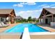 Beautiful pool with diving board and covered seating area offers the perfect outdoor space at 4931 Kerrington Blvd, Bargersville, IN 46106