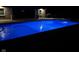 Stunning pool at night with beautiful lighting, enhancing the ambiance and creating a serene environment at 4931 Kerrington Blvd, Bargersville, IN 46106