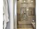 Contemporary shower with stylish tile and a sleek glass door exudes modern luxury at 4931 Kerrington Blvd, Bargersville, IN 46106