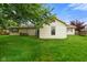 Backyard view of a single-story home and mature trees at 50 Crestview Dr, Greenwood, IN 46143