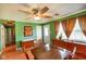 Cozy dining room with wood floors, natural light, and a ceiling fan at 50 Crestview Dr, Greenwood, IN 46143