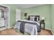 Comfortable bedroom with en suite bathroom features natural light, carpeted floor and neutral walls at 5010 Donner Ln, Indianapolis, IN 46268