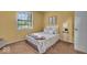 Cozy bedroom featuring natural light and carpet floors, ideal for rest and relaxation at 5010 Donner Ln, Indianapolis, IN 46268