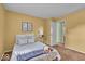 A relaxing bedroom showcasing carpet floors, a comfy bed, and an open doorway at 5010 Donner Ln, Indianapolis, IN 46268