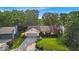 Inviting single-story home with lush green lawn and mature trees for added curb appeal at 5010 Donner Ln, Indianapolis, IN 46268