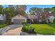 Charming ranch-style home featuring a well-manicured lawn and an attached two-car garage at 5010 Donner Ln, Indianapolis, IN 46268