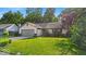 Charming ranch-style home featuring a well-manicured lawn and an attached two-car garage at 5010 Donner Ln, Indianapolis, IN 46268