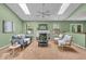 Bright living room featuring skylights, a ceiling fan, and a cozy fireplace at 5010 Donner Ln, Indianapolis, IN 46268
