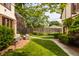 Lush backyard featuring manicured lawn, brick patio, and walkway, perfect for outdoor enjoyment at 5615 N Pennsylvania St, Indianapolis, IN 46220