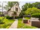 Serene backyard with lush lawn, brick patio, and comfortable outdoor seating area at 5615 N Pennsylvania St, Indianapolis, IN 46220