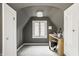 Charming room boasts neutral walls, carpet, and a vanity with good natural light at 5615 N Pennsylvania St, Indianapolis, IN 46220