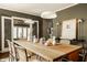 Well-appointed dining room featuring a wooden table with stylish decor, seating for many, and elegant lighting at 5615 N Pennsylvania St, Indianapolis, IN 46220