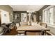 Elegant dining room with a long wooden table, stylish chairs, and unique artwork creating a sophisticated ambiance at 5615 N Pennsylvania St, Indianapolis, IN 46220