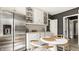 Beautiful kitchen with stainless steel refrigerator, white cabinets and eat in area at 5615 N Pennsylvania St, Indianapolis, IN 46220