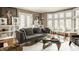 Bright living room with hardwood floors, fireplace, large windows, and stylish contemporary furnishings at 5615 N Pennsylvania St, Indianapolis, IN 46220