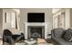 Living room with fireplace, hardwood floors, and stylish contemporary furnishings at 5615 N Pennsylvania St, Indianapolis, IN 46220