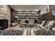 Comfortable living room with stone fireplace, built-in bookshelves and modern decor at 5615 N Pennsylvania St, Indianapolis, IN 46220