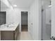 Elegant bathroom features a double vanity and a glass shower enclosure at 5763 Greenbrier Ct, Brownsburg, IN 46112