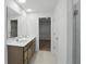 Elegant bathroom features a double vanity and a glass shower enclosure at 5763 Greenbrier Ct, Brownsburg, IN 46112