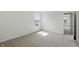 Bright bedroom with contemporary carpet, sunlit window, and white trim at 5763 Greenbrier Ct, Brownsburg, IN 46112
