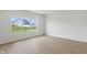 Clean bedroom with wood flooring and a view of the backyard through a large window at 5763 Greenbrier Ct, Brownsburg, IN 46112