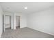 Bright bedroom with plush carpet, neutral walls and an attached closet at 5763 Greenbrier Ct, Brownsburg, IN 46112