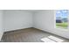 Light filled bedroom featuring neutral carpeting and a sunny window at 5763 Greenbrier Ct, Brownsburg, IN 46112
