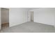 Bedroom boasts modern carpet, open doorway, and crisp white trim at 5763 Greenbrier Ct, Brownsburg, IN 46112