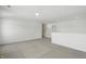 Neutral bonus room featuring new carpet, recessed lighting, and an open floor plan at 5763 Greenbrier Ct, Brownsburg, IN 46112