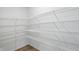 Large walk-in closet provides ample storage space with multiple wire shelving units at 5763 Greenbrier Ct, Brownsburg, IN 46112
