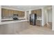 Modern kitchen with stainless steel appliances, a large island, and lots of cabinet storage space at 5763 Greenbrier Ct, Brownsburg, IN 46112