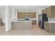 Modern kitchen with stainless steel appliances, a large island, and lots of cabinet storage space at 5763 Greenbrier Ct, Brownsburg, IN 46112