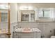 Bathroom featuring a pink sink, tiled walls, and vintage fixtures at 5841 N Parker Ave, Indianapolis, IN 46220